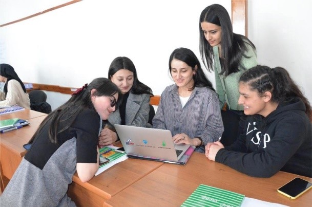 A group of young women work together.