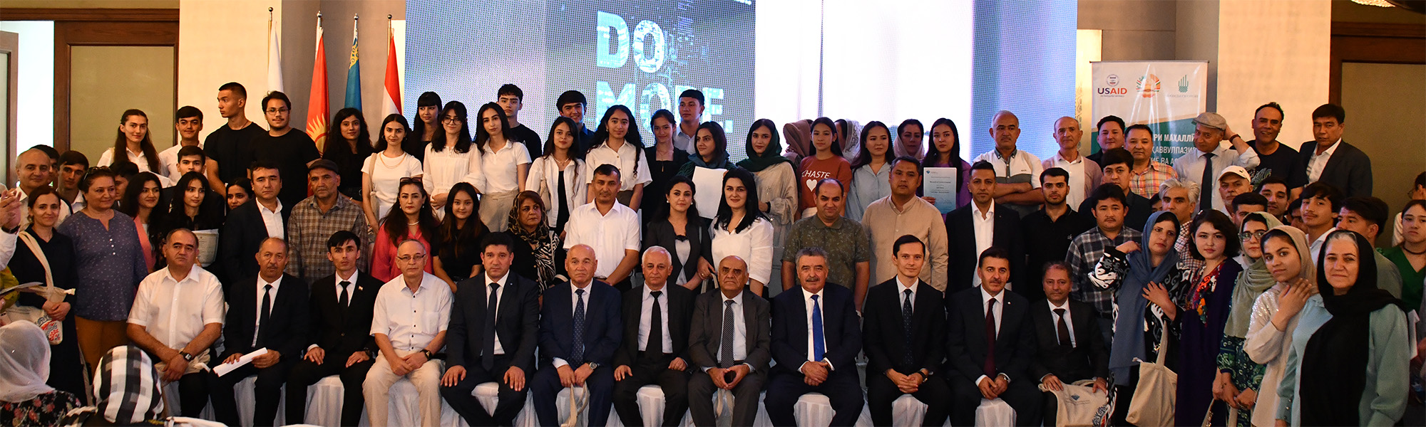 A group photo of graduates and officials at the graduation of UCA SPCE students.