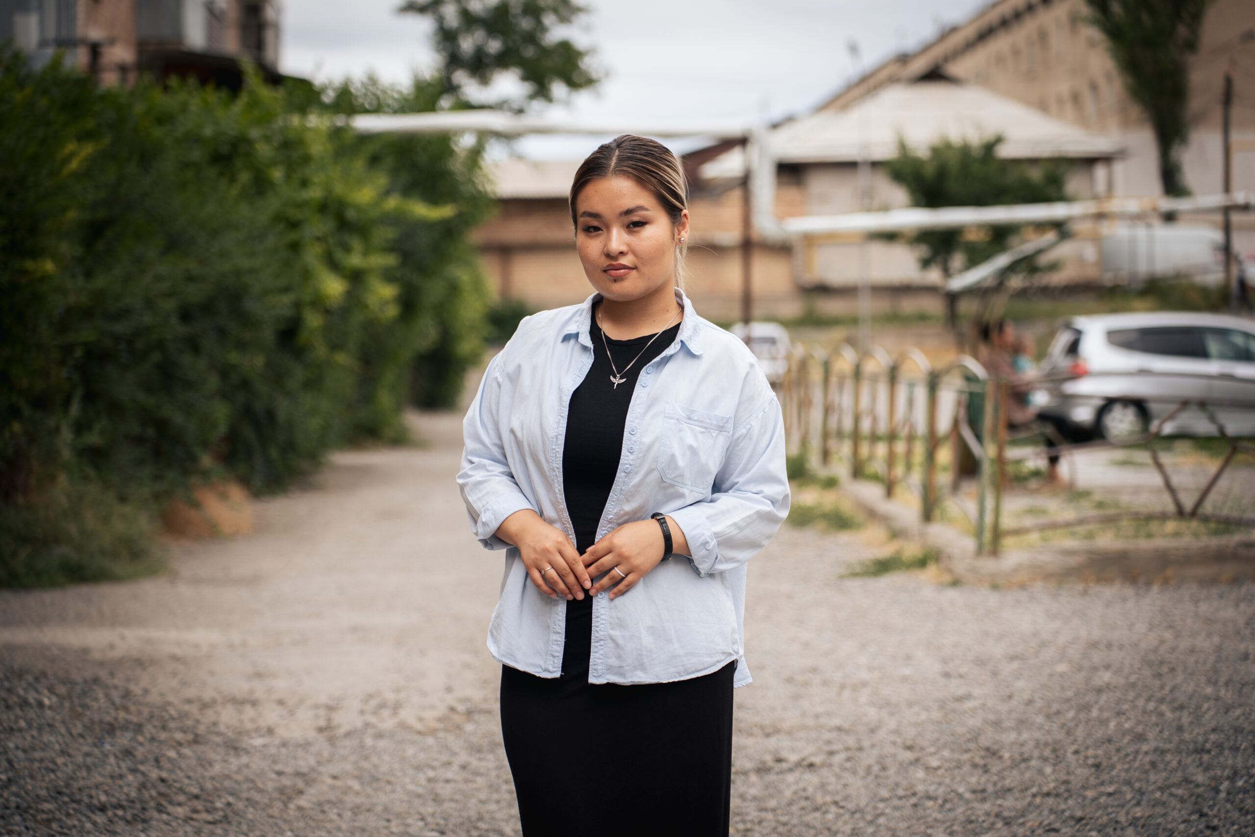 Ayana stands in her neighborhood in Osh, Kyrgyz Republic.