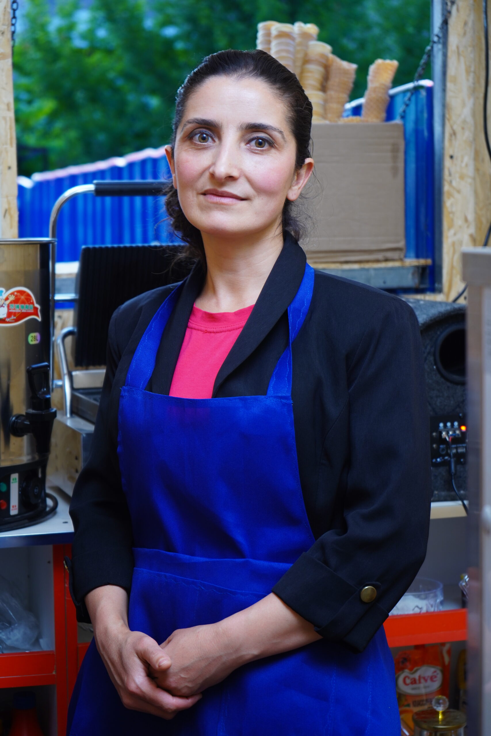 Portrait of Benazir wearing an apron.