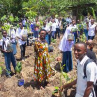 Students, teachers, and volunteer parents engage in planting micro forests at Mbande secondary schools at Temeke MC Dar es Salaam.