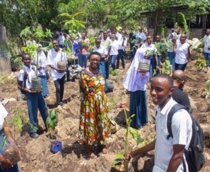 Students, teachers, and volunteer parents engage in planting micro forests at Mbande secondary schools at Temeke MC Dar es Salaam.